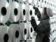 Chinese worker making blankets for export at a factory in Yiwu, Zhejiang, China.
