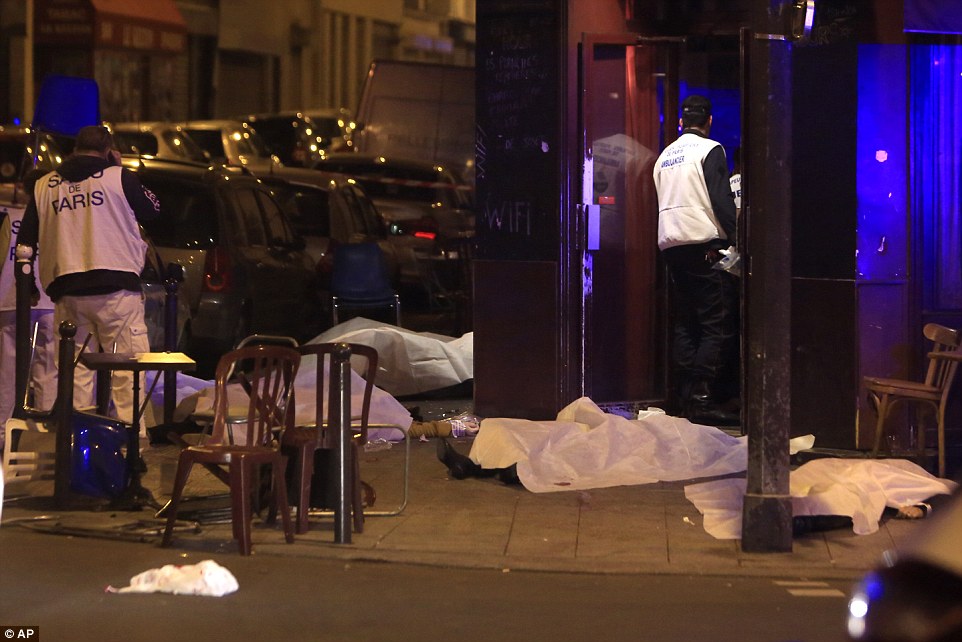Victims lay on the pavement outside Paris restaurant following a terror attack in the French capital tonight