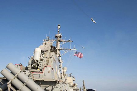 An U.S. Navy picture shows what appears to be a Russian Sukhoi SU-24 attack aircraft flying over the U.S. guided missile destroyer USS Donald Cook in the Baltic Sea