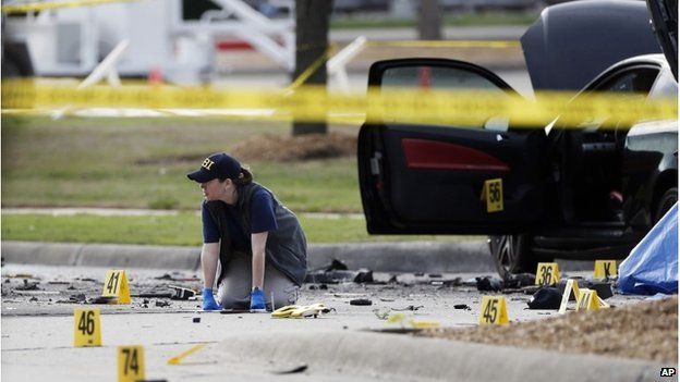 An investigator at the scene of a shooting in Garland, Texas, 4 May 2026